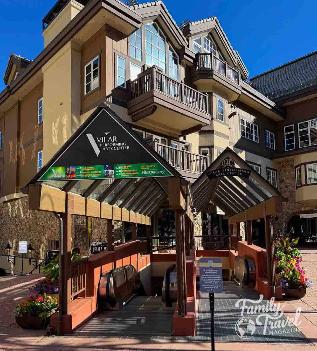 Vilar Performing Arts Center entrance in Beaver Creek, Colorado, with escalators leading into the building.
