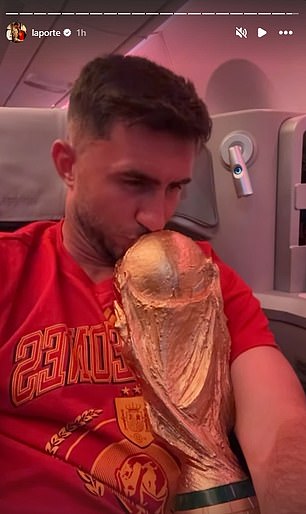 Aymeric Laporte posed with the World Cup trophy onboard the plane