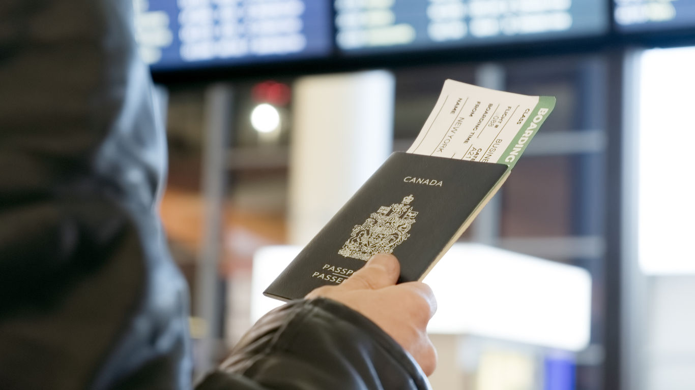 Man with Canadian passport and boarding pass