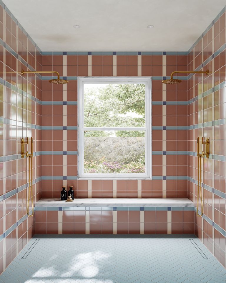 Bathroom with tiled walls a window a bench and brass fixtures