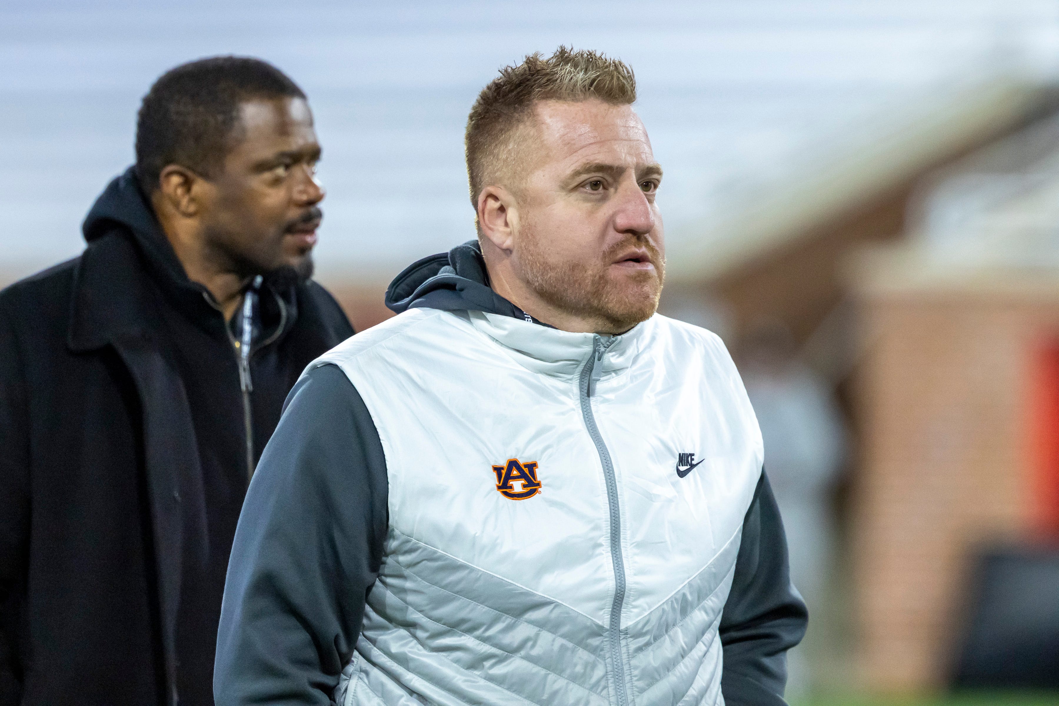 Jan 28, 2026; Mobile, AL, USA; Auburn head football coach Alex Golesh visits the field during American Senior Bowl practice at Hancock Whitney Stadium. Mandatory Credit: Vasha Hunt-Imagn Images