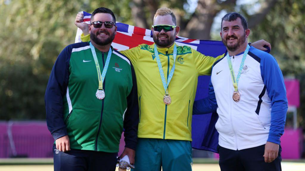 Kelly (left) won silver in the men's singles in Birmingham