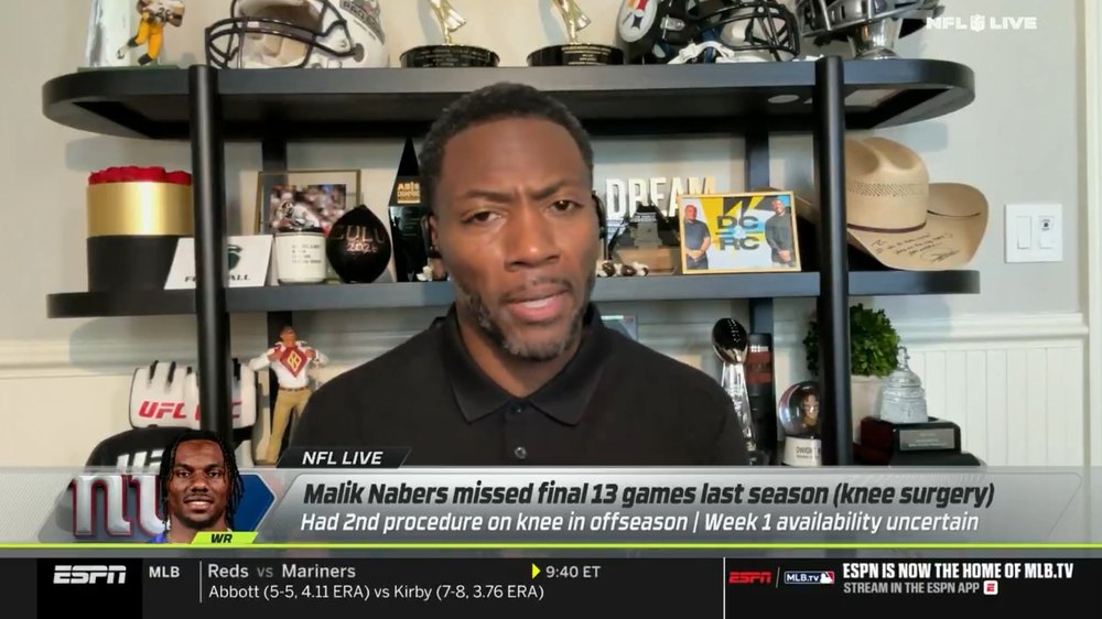 Ryan Clark is seen broadcasting on ESPN shortly before he was fired by the network on July 20