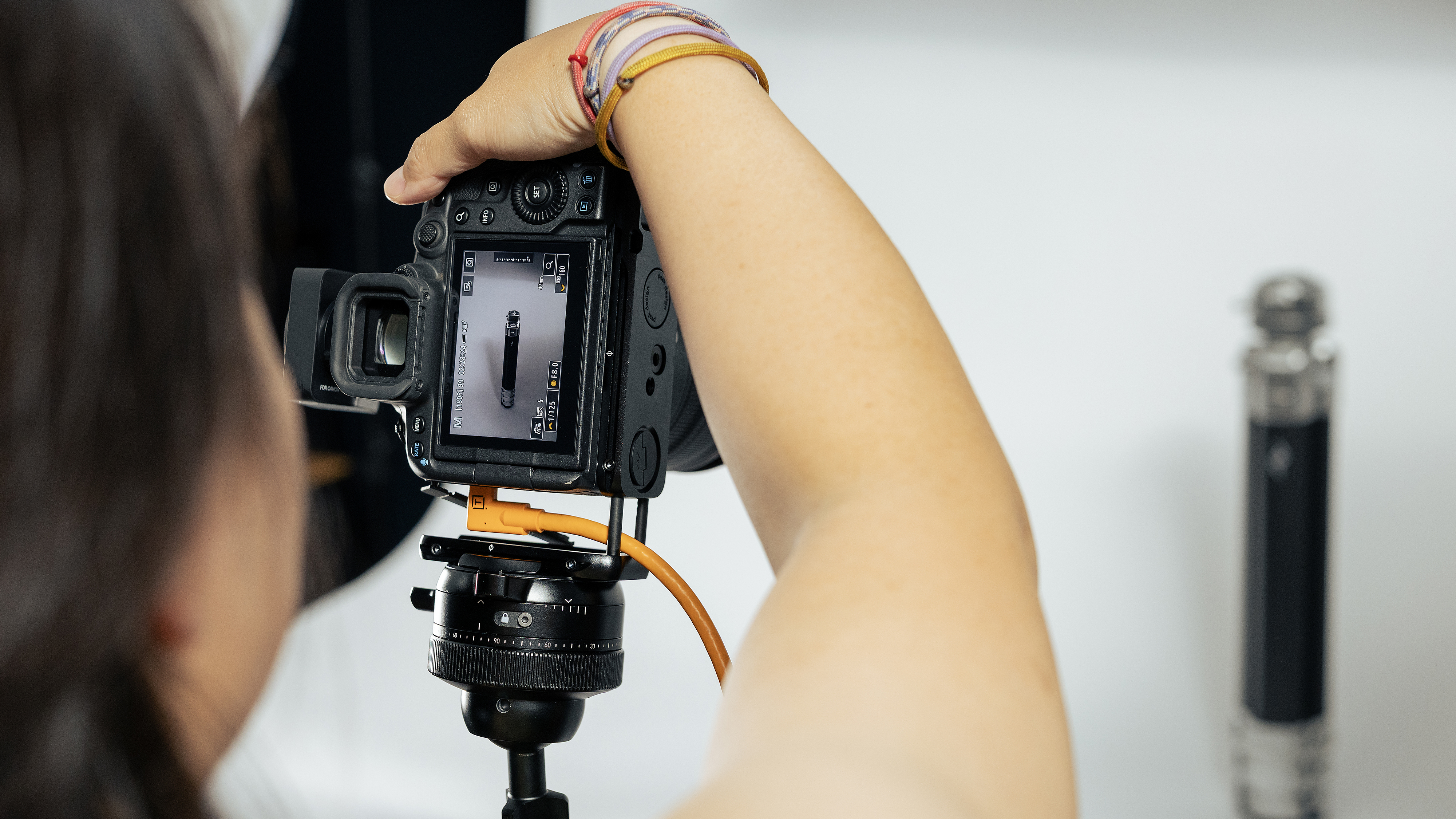 The Peak Design Field Bracket being used by a photographer