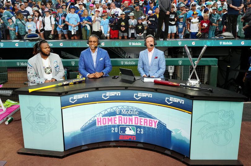 Vladimir Guerrero Jr. #27 of the Toronto Blue Jays talks with Karl Ravech and Eduardo Pérez from ESPN Baseball Tonight after the T-Mobile Home Run Derby at T-Mobile Park on Monday, July 10, 2023, in Seattle, Washington.