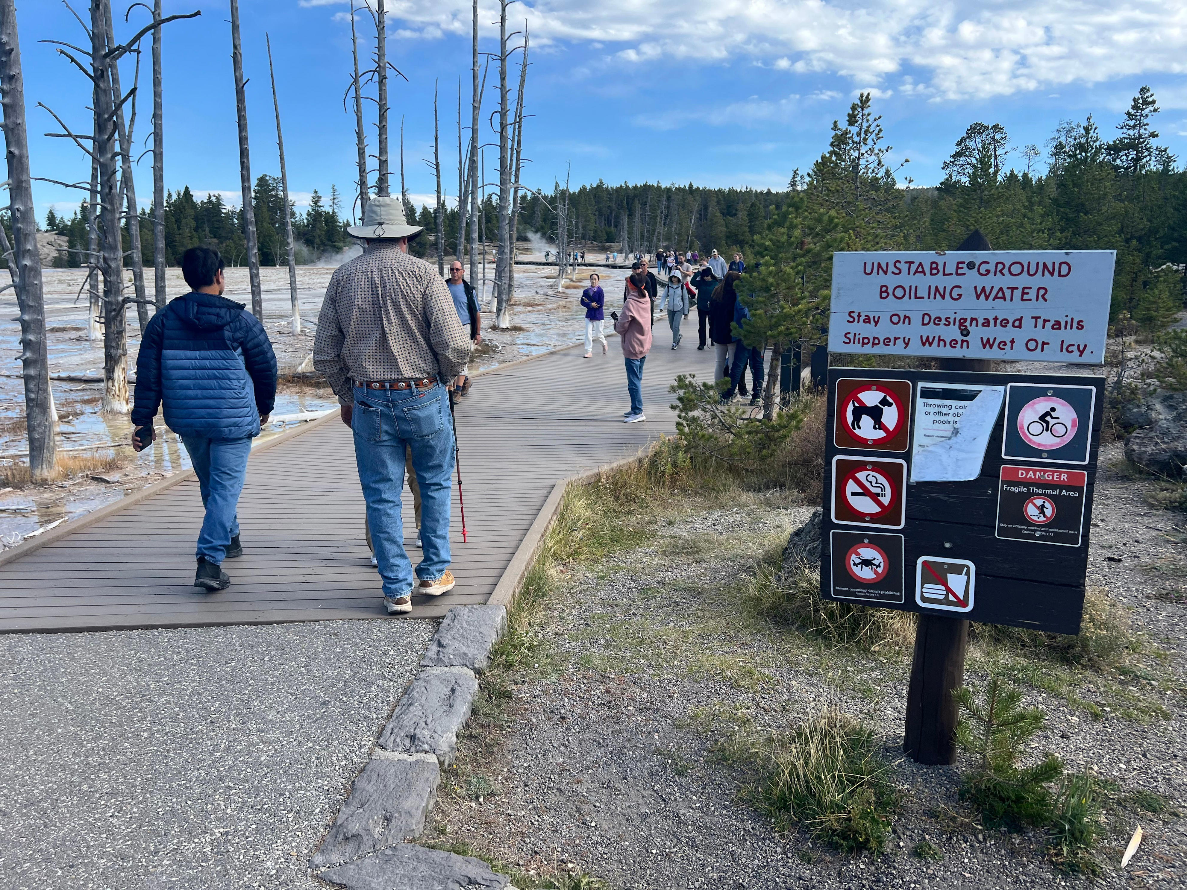 Tourists caught walking on Yellowstone hot spring's deadly crust