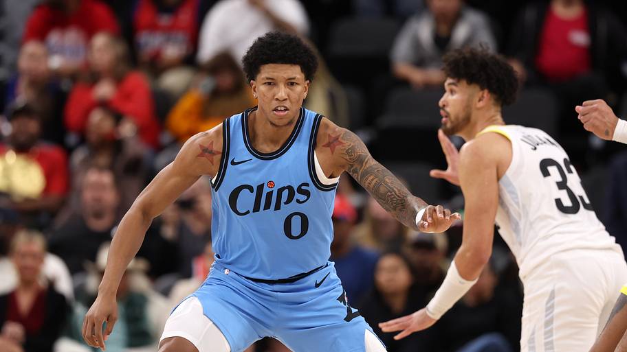 Los Angeles Clippers forward MarJon Beauchamp defends Utah Jazz guard Johnny Juzang