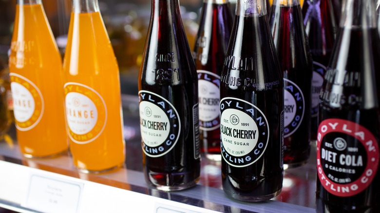 Various flavors of Boylan sodas on a store shelf, including black cherry, orange, and diet cola