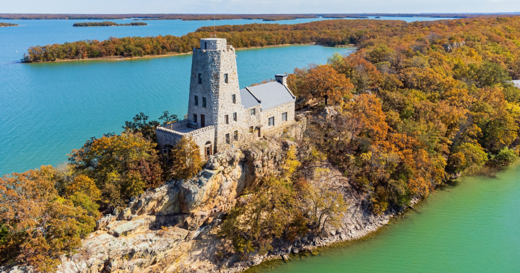 Tucker Tower sits among rock formations and fall foliage in Lake Murray State Park in Ardmore, OK