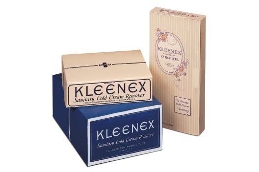 Stacked vintage Kleenex boxes: two are labeled "Sanitary Cold Cream Remover," and one is titled "Kleenex Viennese" with floral designs