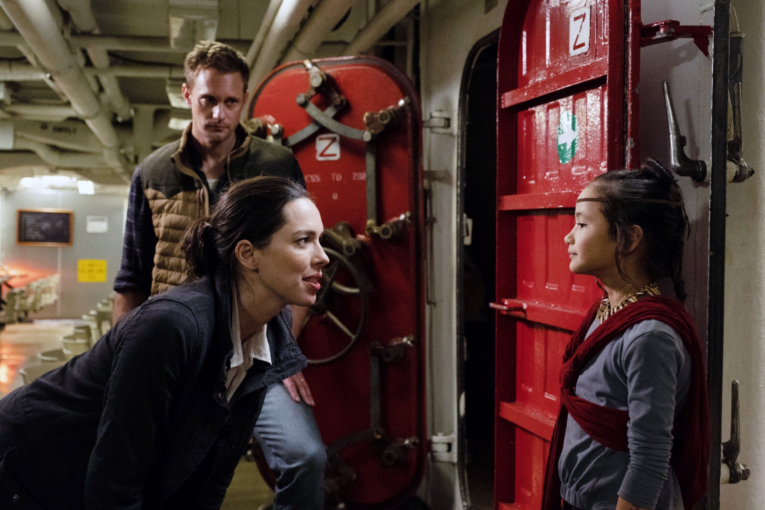 Kaylee Hottle (right) opposite Rebecca Hall and Alexander Skarsgård in Godzilla vs. Kong