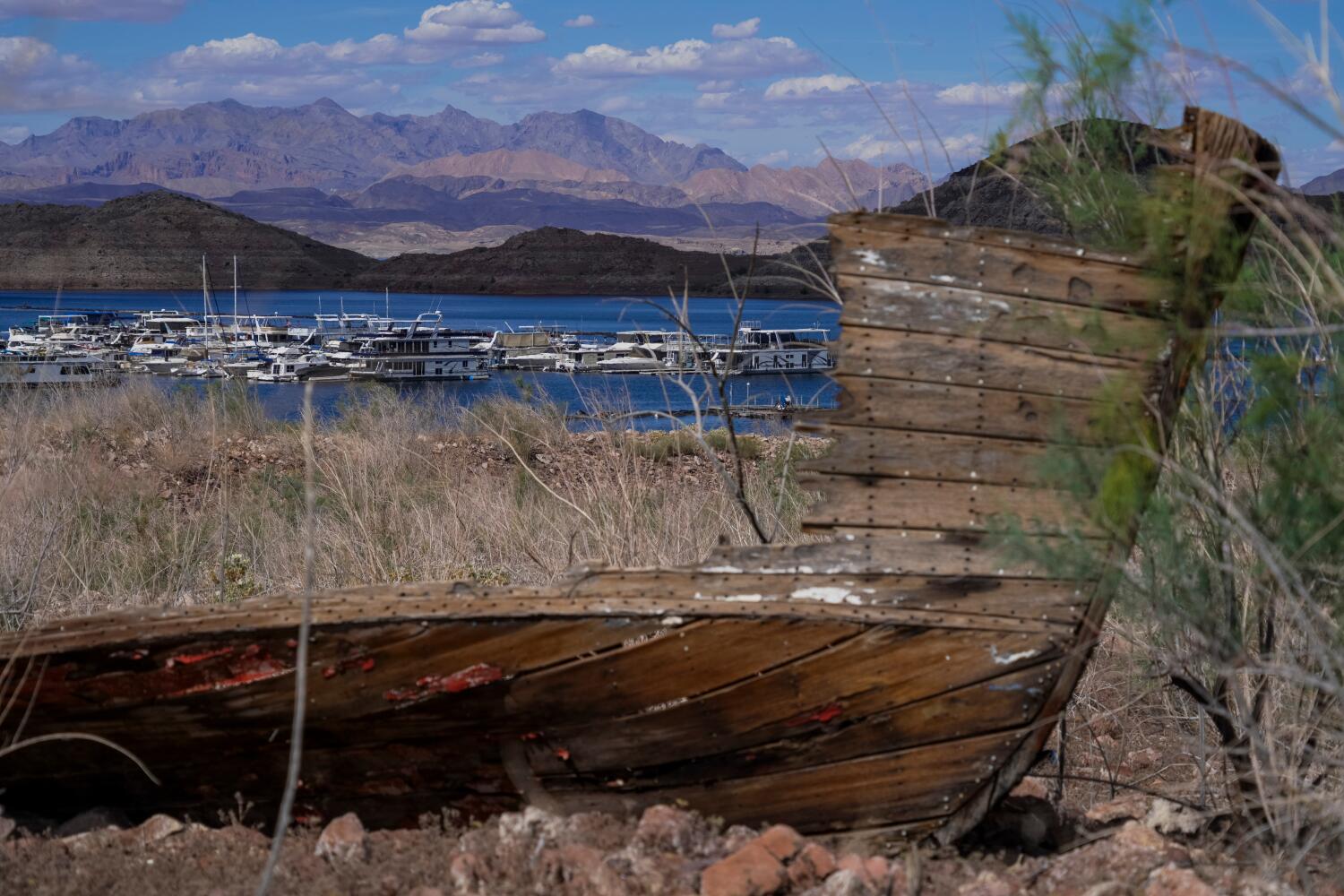 The remains of a boat sit on a dry shore at Lake Mead National Recreation Area.