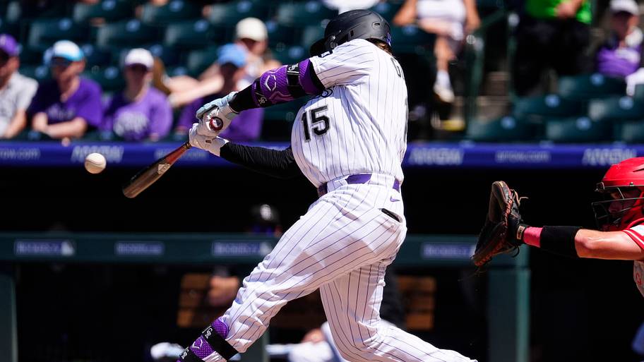 Colorado Rockies catcher Hunter Goodman takes a swing in a game against the Cincinnati Reds.