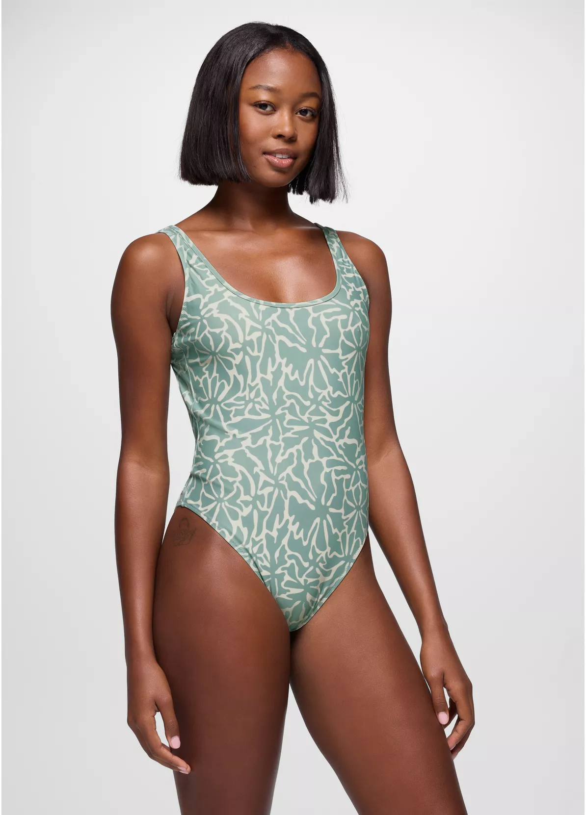 woman wearing prana one piece swimsuit
