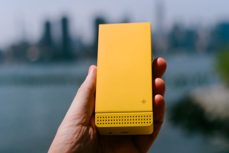 A yellow Light Flip phone.