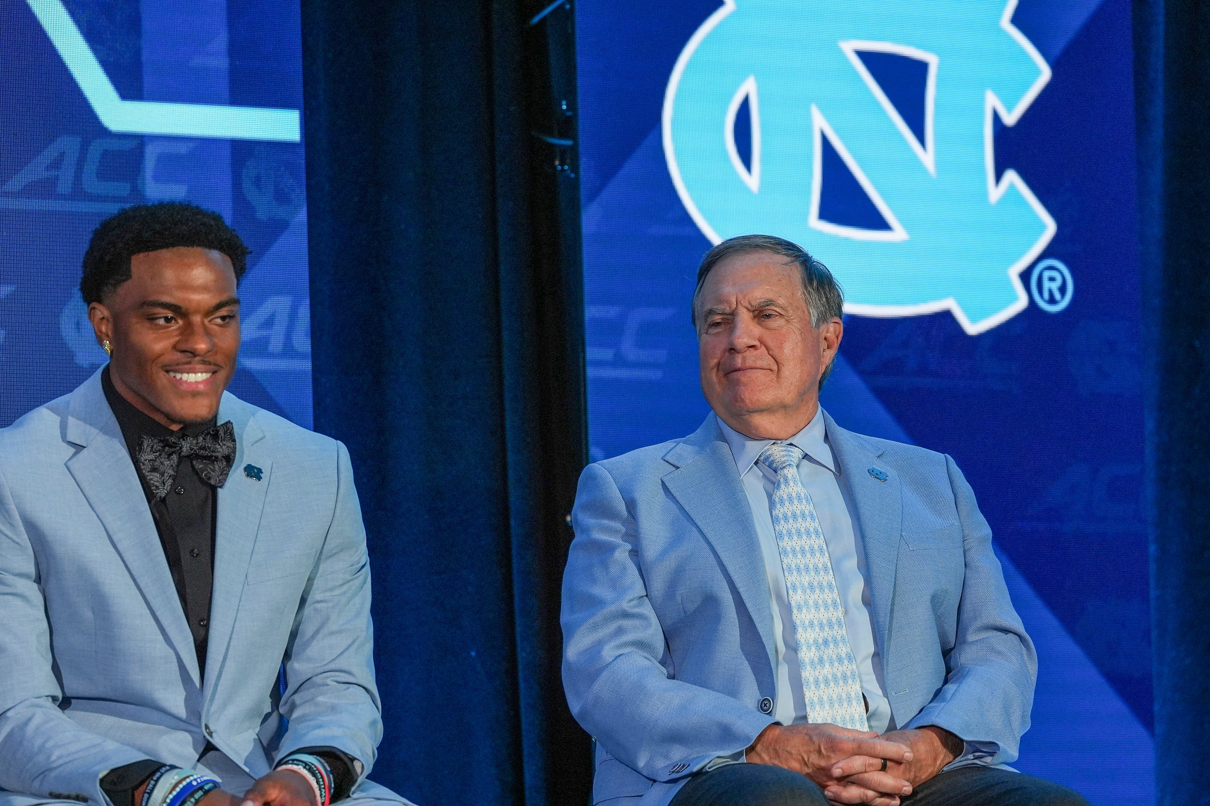 Jul 17, 2026; Charlotte, NC, USA; North Carolina wide reciever Jordan Shipp and head coach Bill Belichick react during a moment with the media during interviews at Hilton Charlotte Uptown. Mandatory Credit: Jim Dedmon-Imagn Images