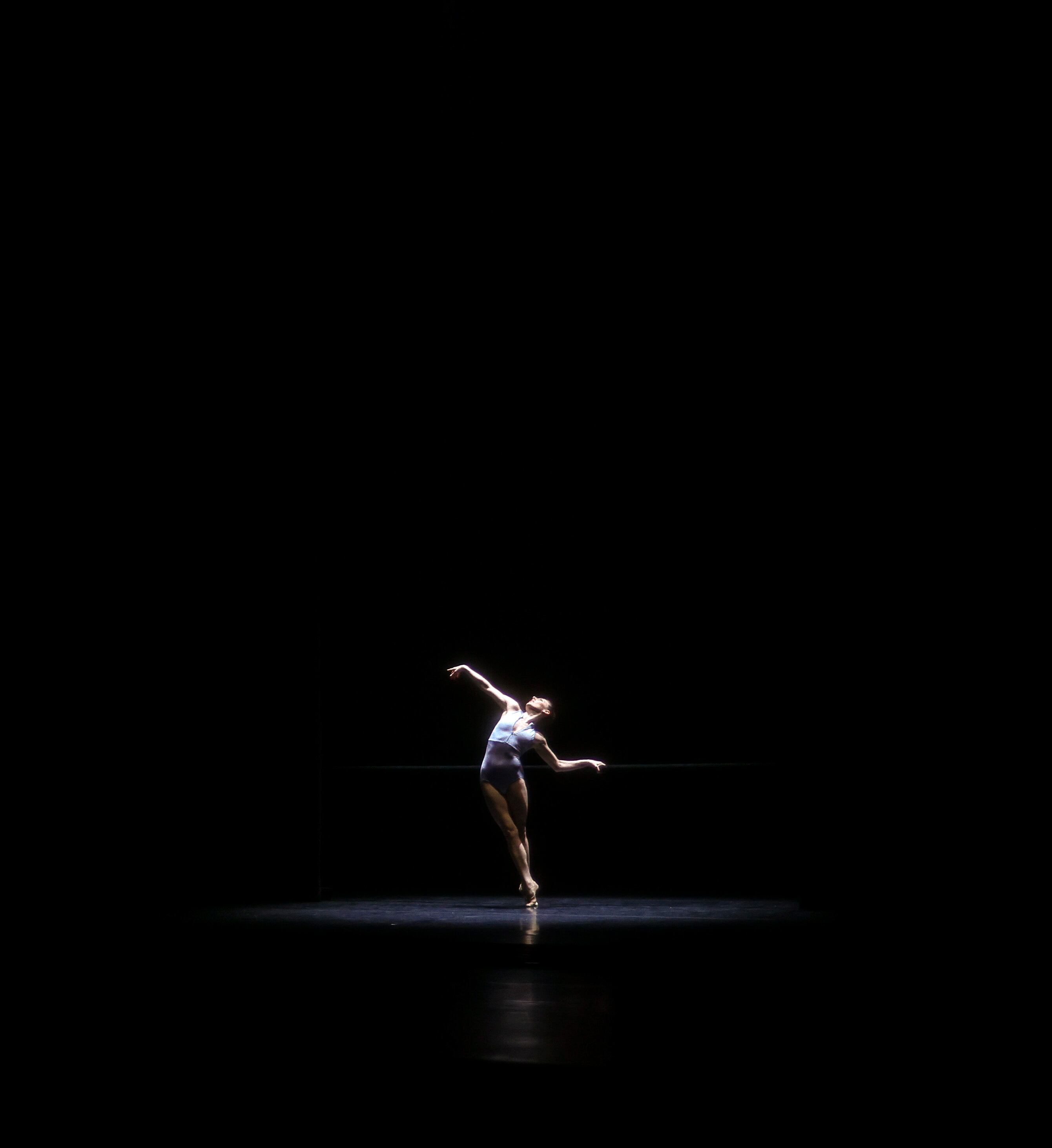 Tiler Peck is seen on stage preforming The Barre Project, Blake Works II during the photocall for