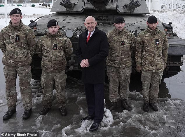 Ally: John Healey, pictured, centre, has been made Chancellor little over a month after quitting as defence secretary in a row over funding for the Armed Forces