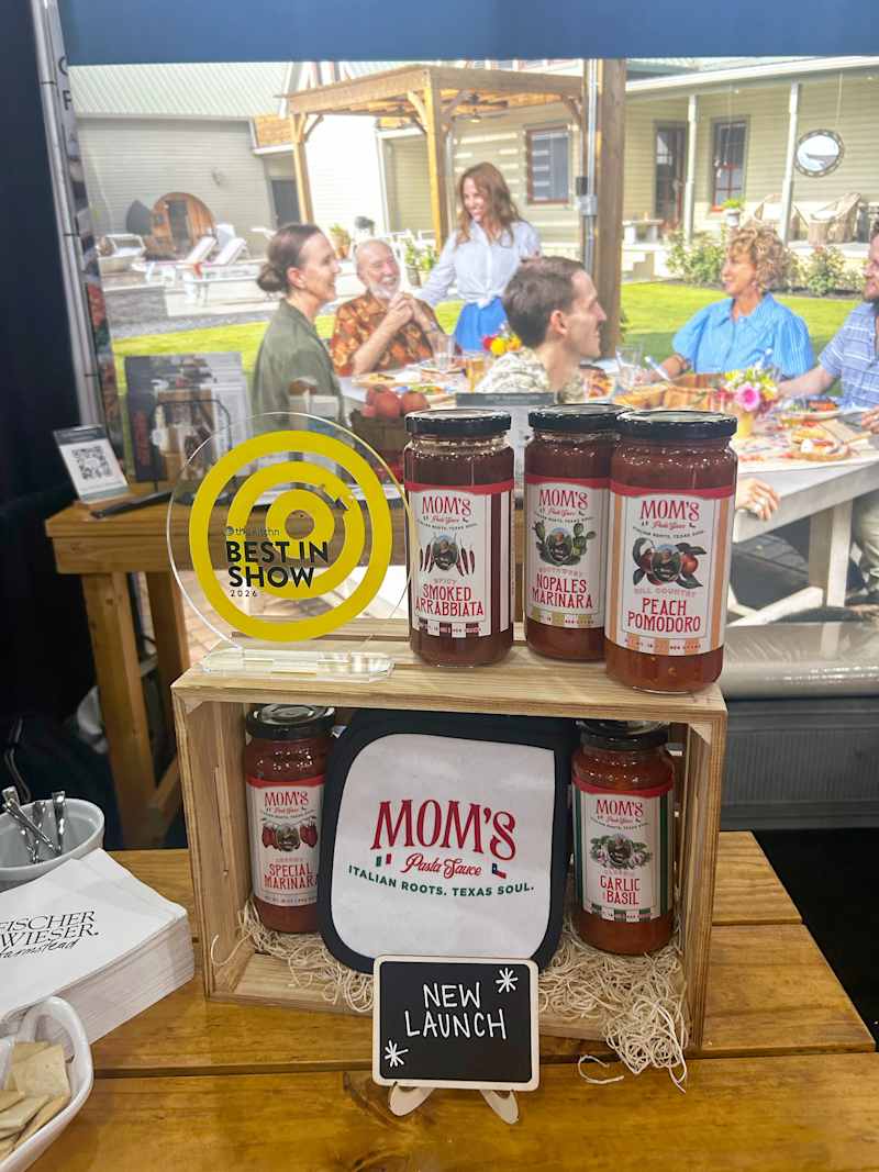 Display of MOM's pasta sauces in jars, with a