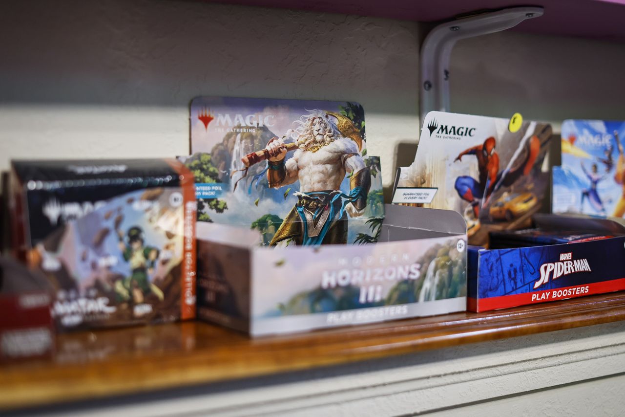 Magic: The Gathering products sit on display