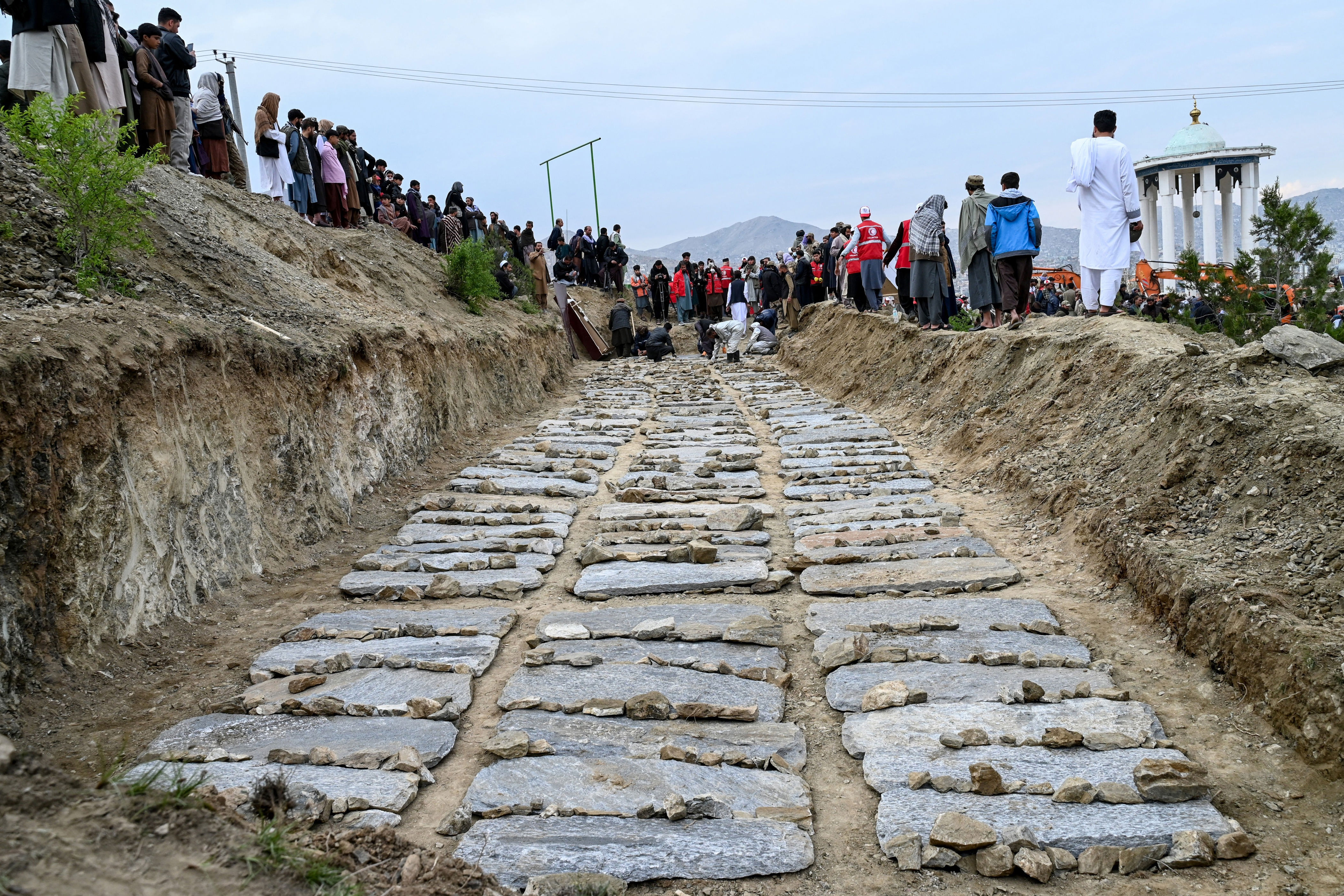 A mass grave for victims of an alleged Pakistani airstrike on a drug rehabilitation centre in Kabul (AFP via Getty)