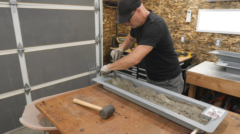 Inventor Kent Gravelle demonstrates how to fill his concete garden panel forms