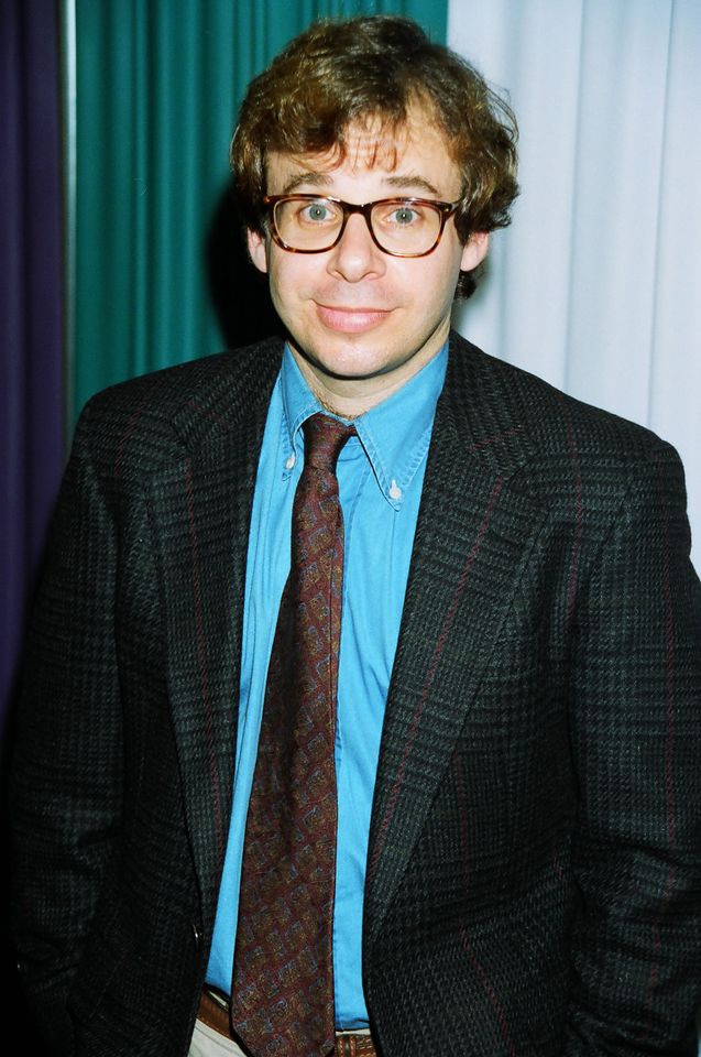 Rick Moranis posing at an event