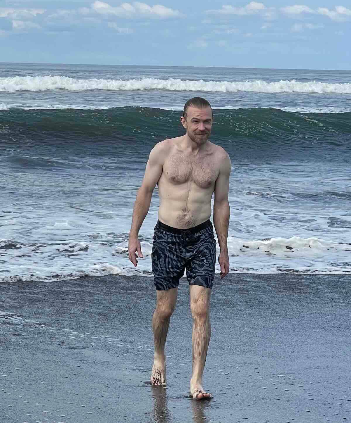 Eco-Stylist founder Garik wearing the apex swim trunks from Outerknown