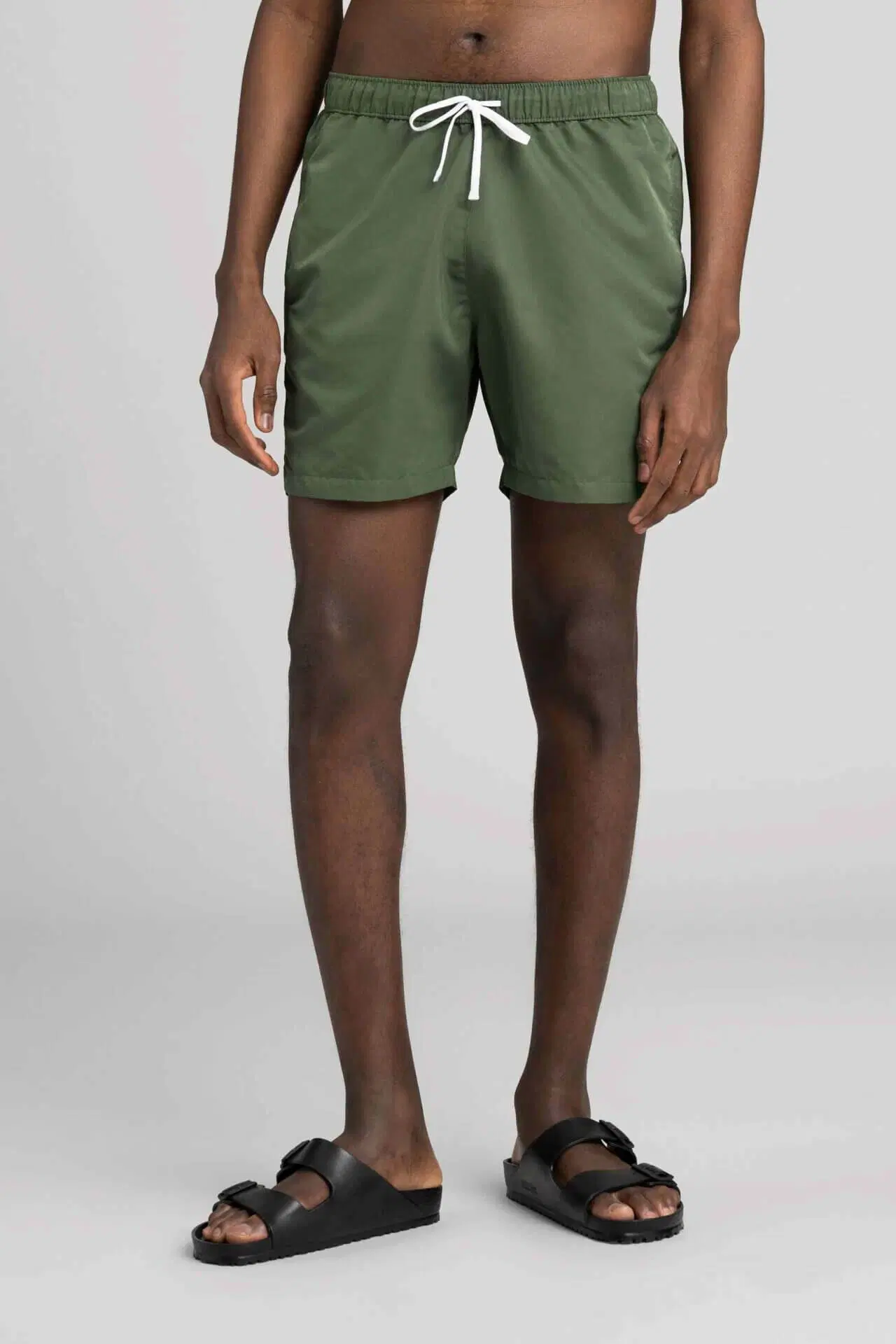 Men's green swim trunks from Asket