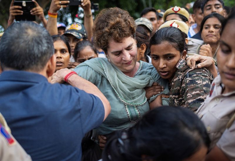 Indian opposition leader Priyanka Gandhi Vadra is detained by police during a sit-in protest outside Prime Minister Narendra Modi's residence in New Delhi
