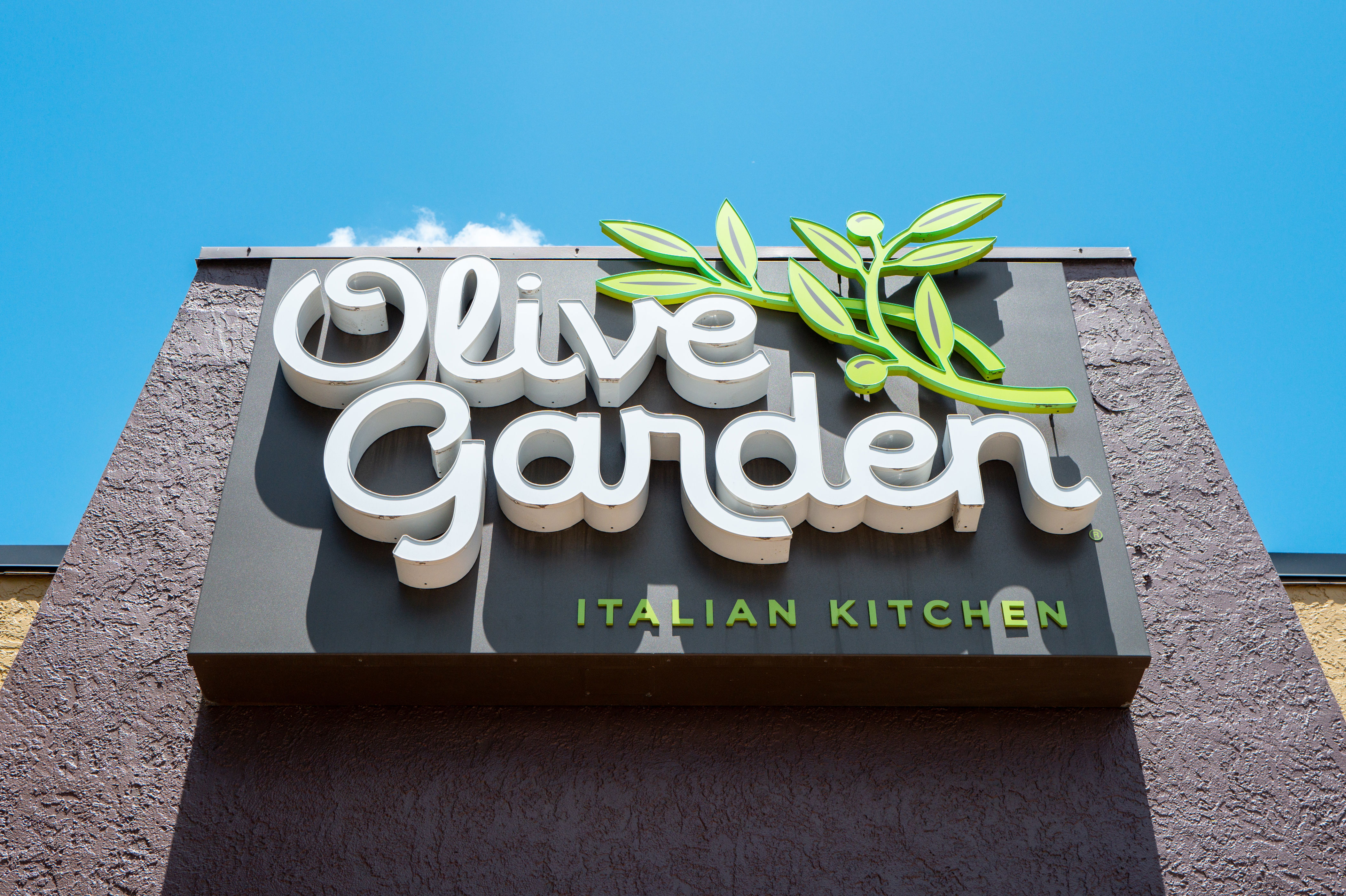 Olive Garden restaurant sign with logo and the words "Italian Kitchen" underneath