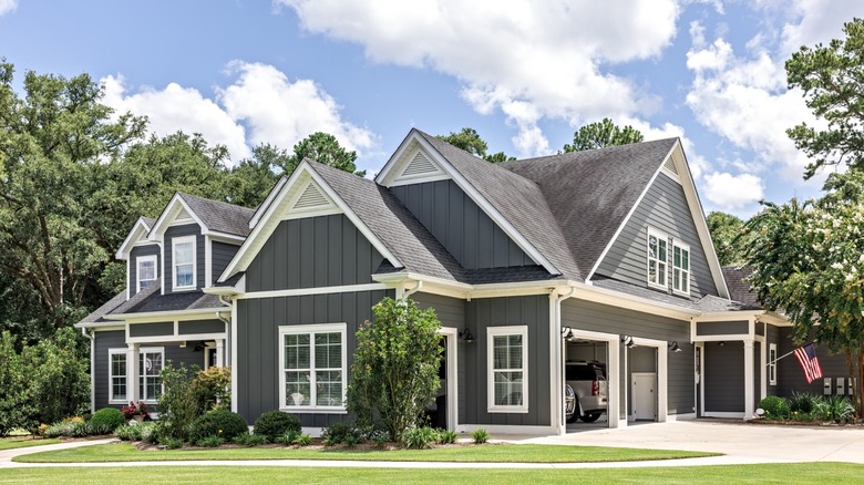 House with cars parked in attached garage
