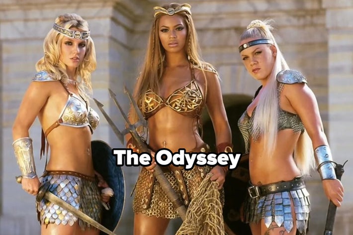 Three women dressed as warriors with shields and tridents stand confidently. Text reads "The Odyssey."