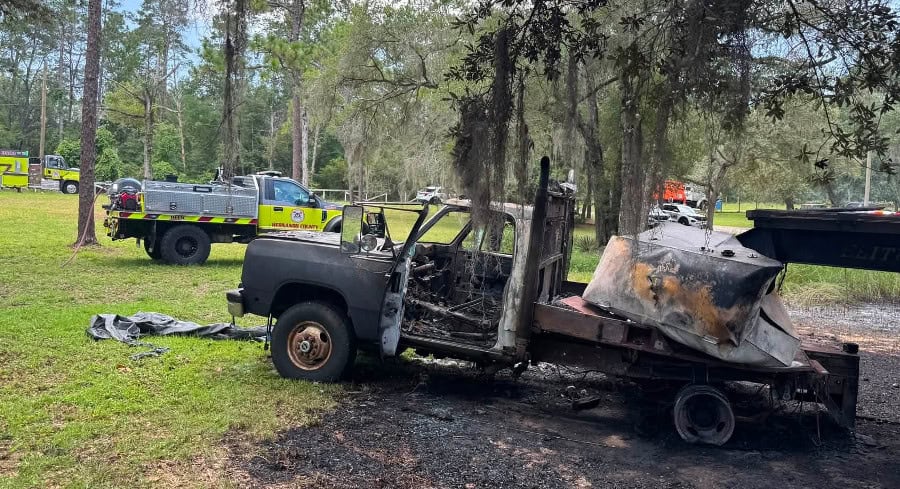Fire brought out of control by burn pit spreads to truck and trailer in Brooksville