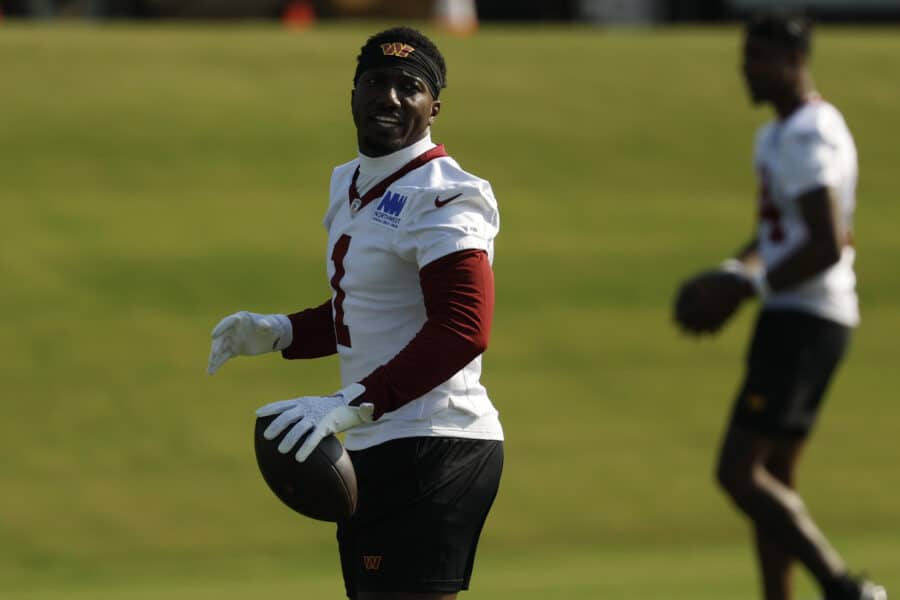 Jul 24, 2025; Ashburn, VA, USA; Washington Commanders wide receiver Deebo Samuel Sr. (1) stands on the field during warmup prior to practice on day two of training camp at OrthoVirginia Training Center at Commanders Park. Mandatory Credit: Geoff Burke-Imagn Images