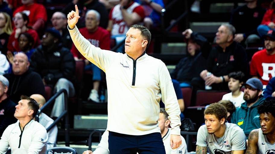 Penn State Nittany Lions men's basketball coach Mike Rhoades calls out a play to his team during the game against Rutgers.
