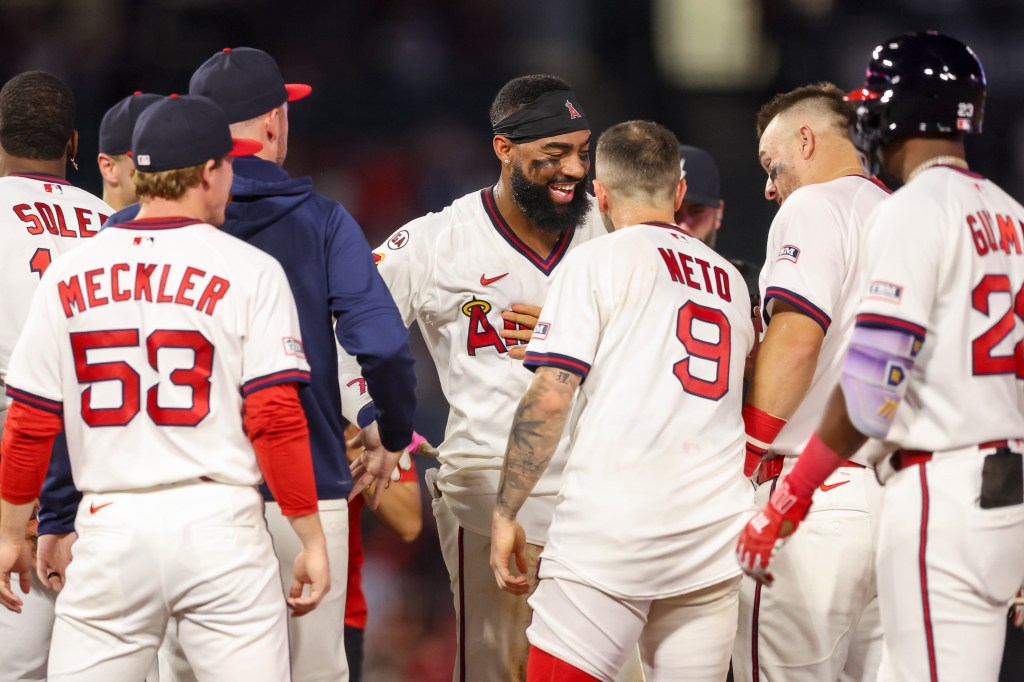 Jo Adell #7 of the Los Angeles Angels reacts with teammates after winning the game with a walk-off hit by pitch against the St. Louis Cardinals at Angel Stadium of Anaheim on July 20, 2026 in Anaheim, California.