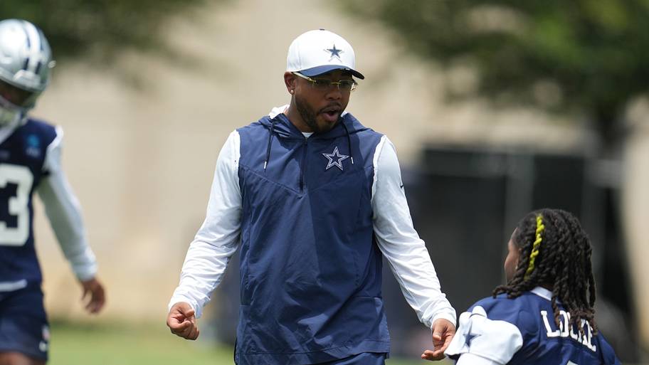 Dallas Cowboys defensive coordinator Christian Parker speaks with wide receiver PJ Locke during practice at the Ford Center.