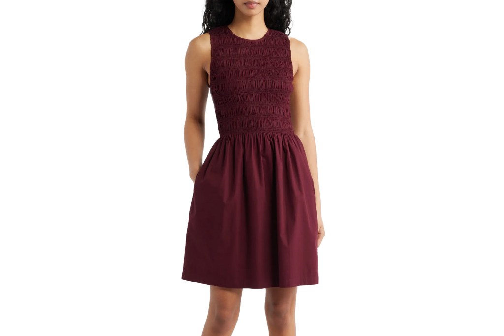 A sleeveless maroon shirred bodice mini dress.