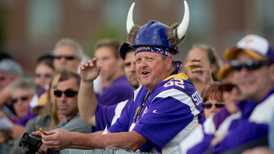 Vikings fans with horns on helmet.