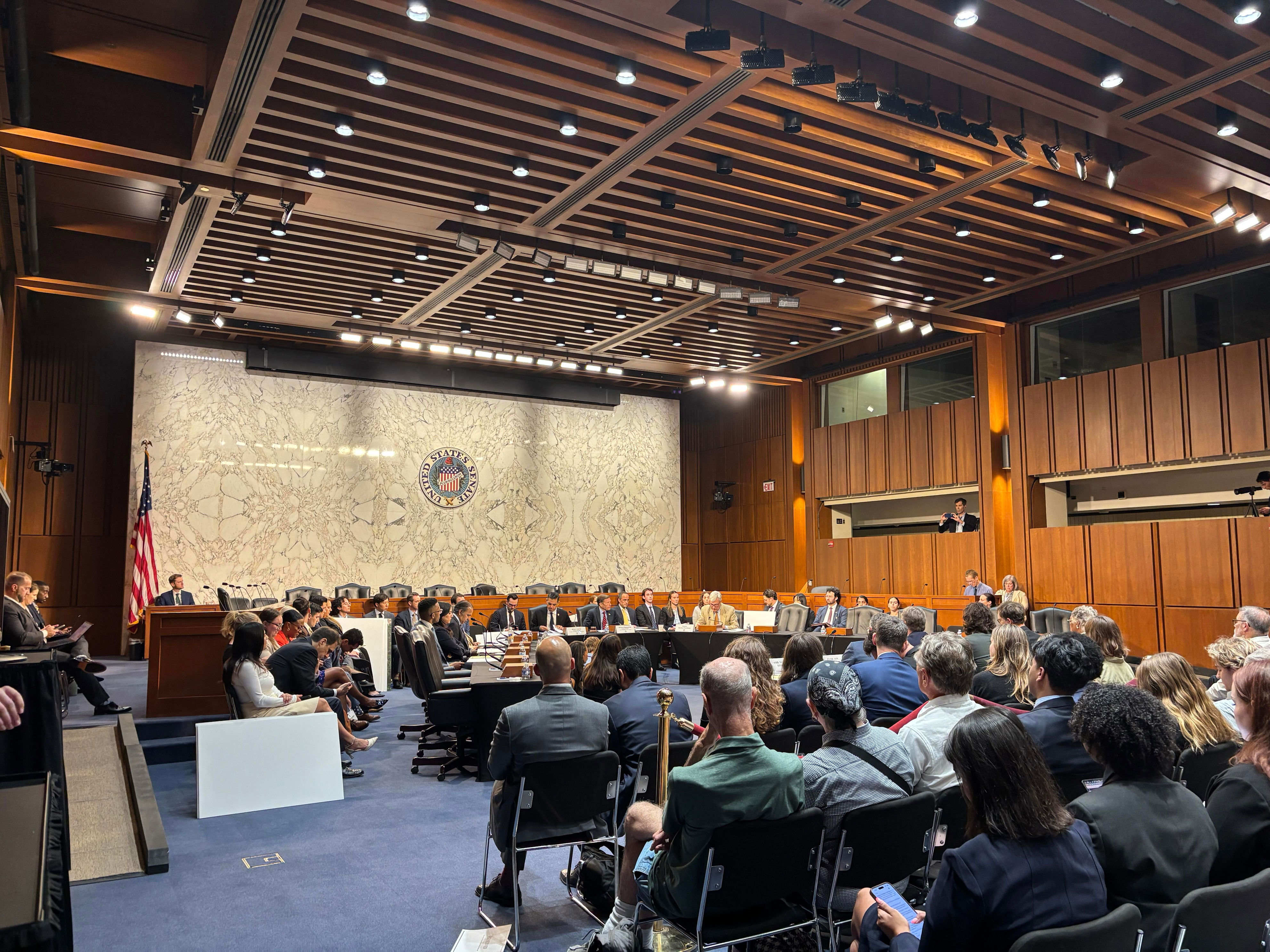 Democratic lawmakers sat at temporary tables on the floor of a Senate hearing room for a shadow hearing on President Trump's construction projects, July 21, 2026. / Credit: CBS News / Arden Farhi