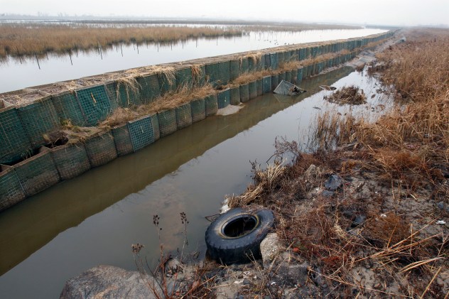 File image: In this Dec. 8, 2012 photo, the Richard P. Kane Wetland Mitigation Bank, a long barrier wall made of large baskets filled with sand and dirt, runs through the Meadowlands in Moonachie, N.J.(AP Photo/Mel Evans)