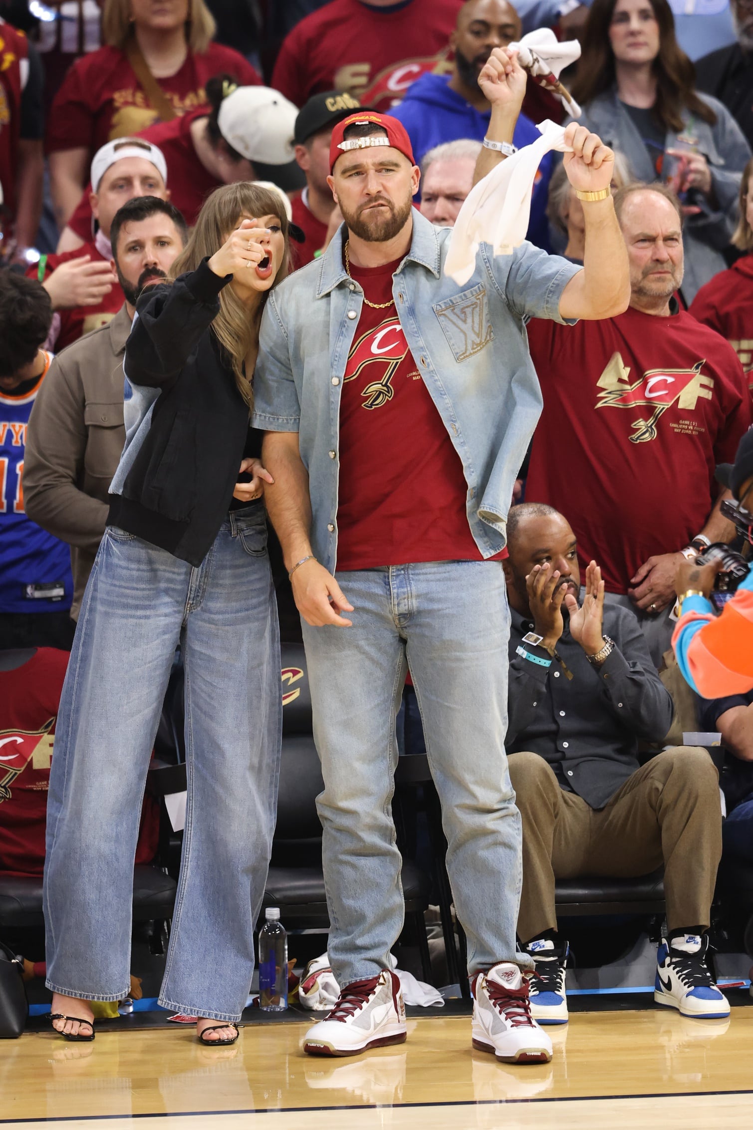 May 23, 2026; Cleveland, Ohio, USA; Taylor Swift and Travis Kelce react during game three of the eastern conference finals for the 2026 NBA playoffs between the New York Knicks and Cleveland Cavaliers at Rocket Arena. Mandatory Credit: Scott Galvin-Imagn Images