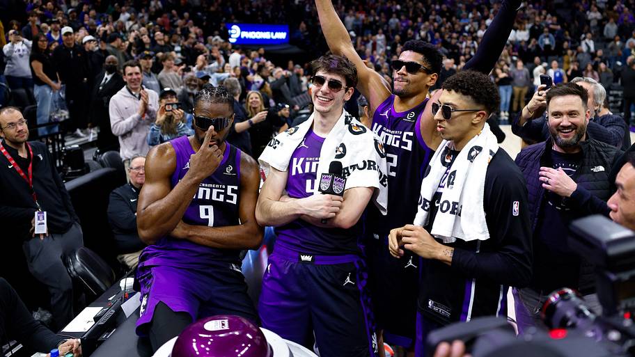 Sacramento Kings Precious Achiuwa (9) and Maxime Raynaud (42) and Dylan Cardwell (32) and guard Nique Clifford celebrate