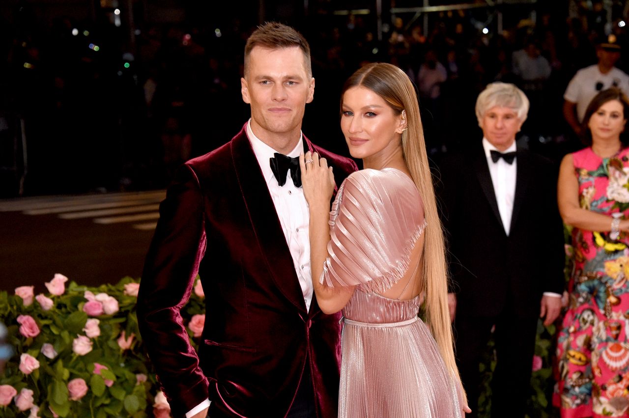 Tom Brady and Gisele Bndchen posing at a formal event