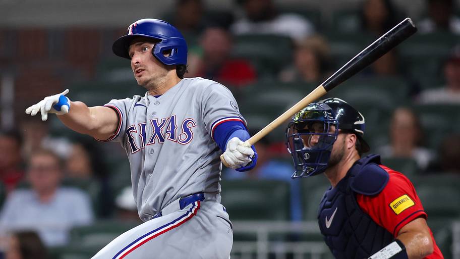 Texas Rangers designated hitter Justin Foscue follows through on a swing at the plate.