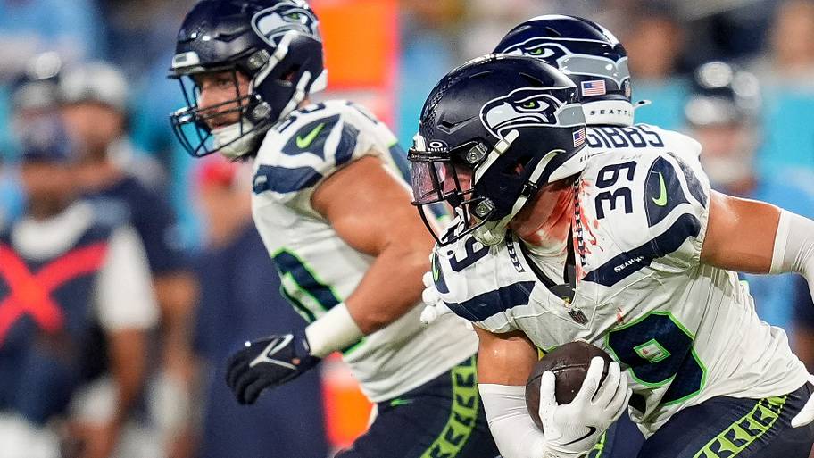 Seattle Seahawks safety Ty Okada runs the ball against the Tennessee Titans during the fourth quarter.