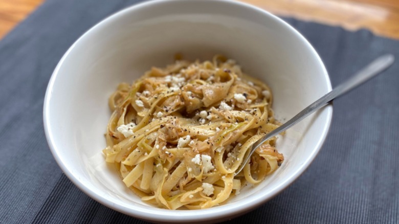 Bowl of cabbage and pasta with fork
