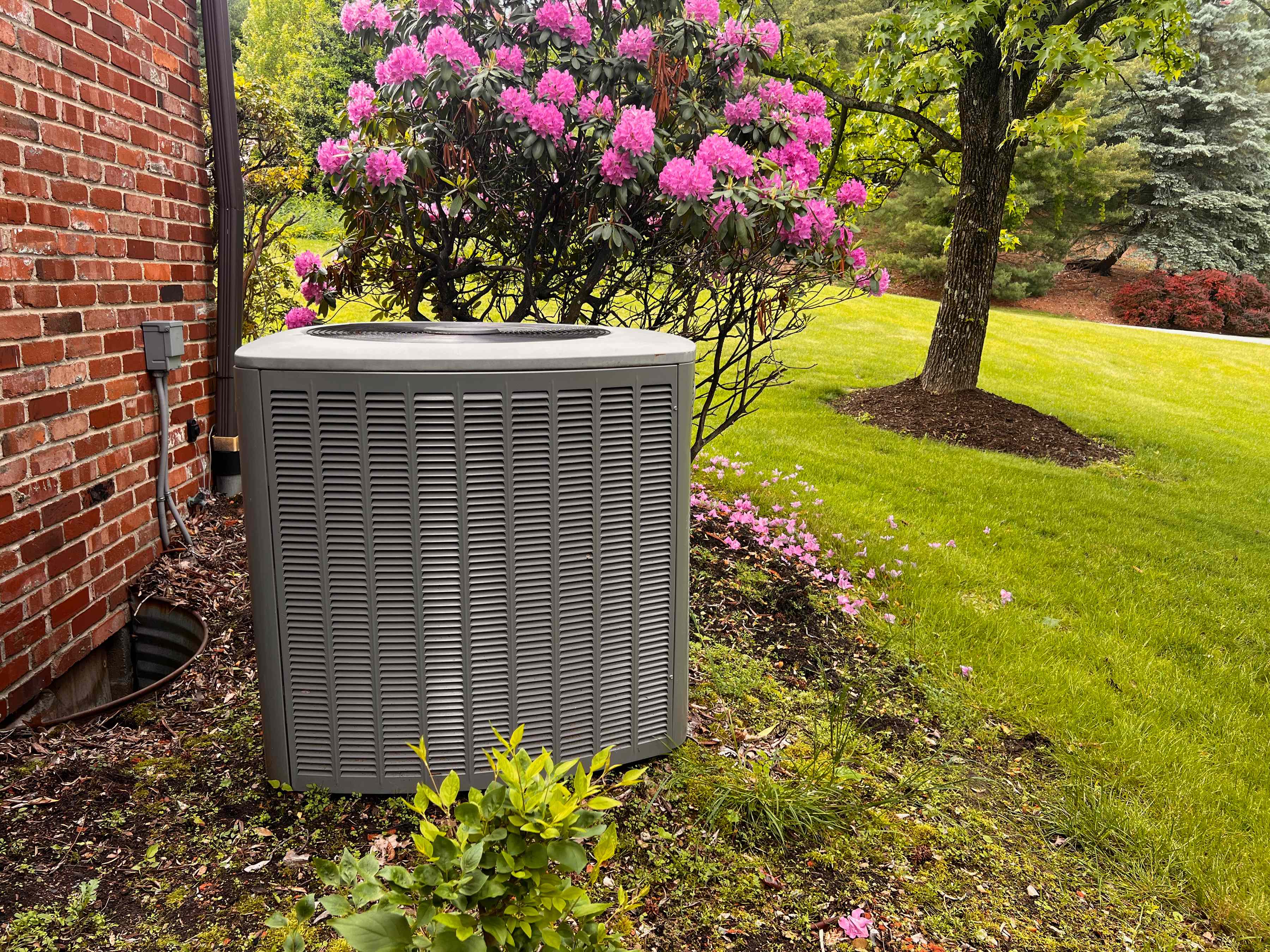 How to safely clear debris from your outdoor AC unit before it causes problems