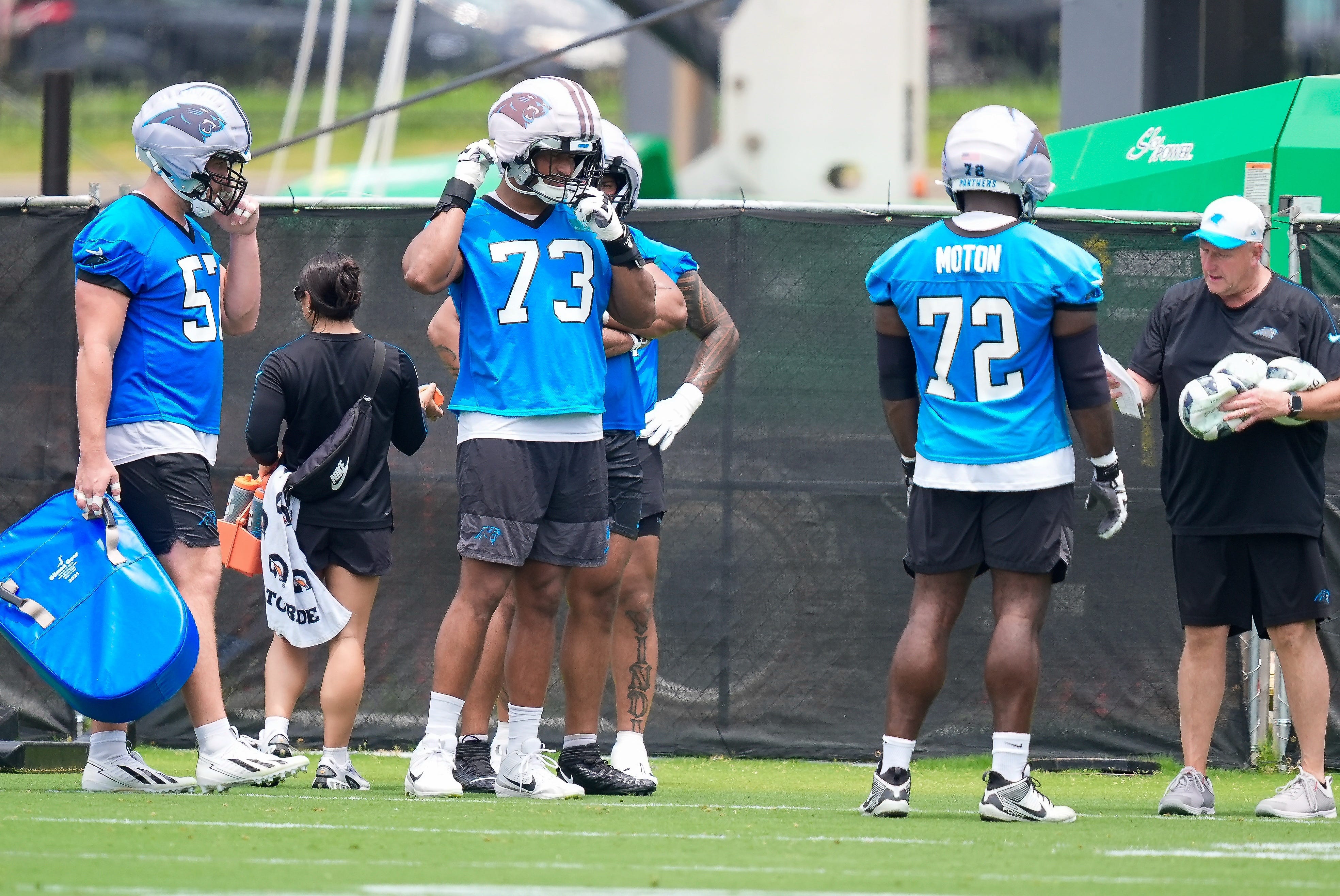Jun 9, 2026; Charlotte, NC, USA; Carolina Panthers tackle Monroe Freeling (57), tackle Stone Forsythe (73) and offensive tackle Taylor Moton (72) during the first day of mini camp at Bank of America Stadium practice facility. Mandatory Credit: Jim Dedmon-Imagn Images